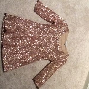Gold sequin dress with back out. Very sexy!